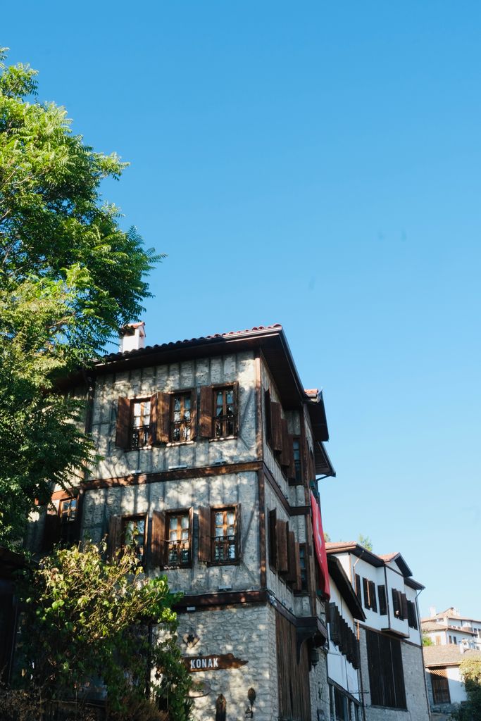 Charming old Ottoman-style house under a clear blue sky.